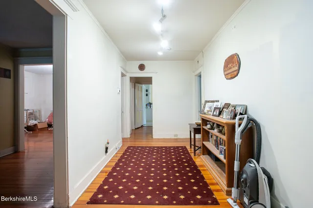 a bedroom with a bed and a book shelf