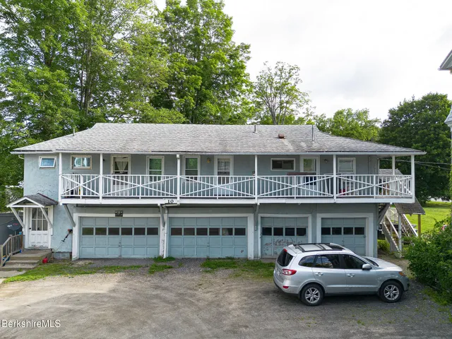 a car parked in front of a house