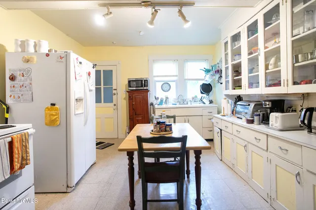 a bathroom with a toilet a sink and a shower