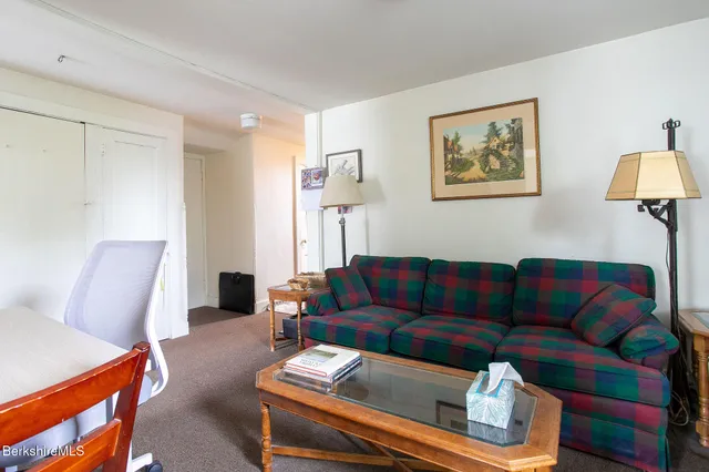 an aerial view of a house with yard