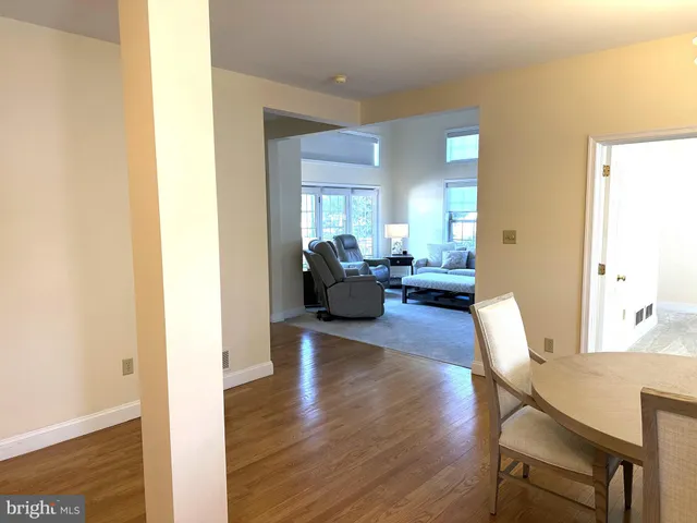 a kitchen with a table chairs sink and stove