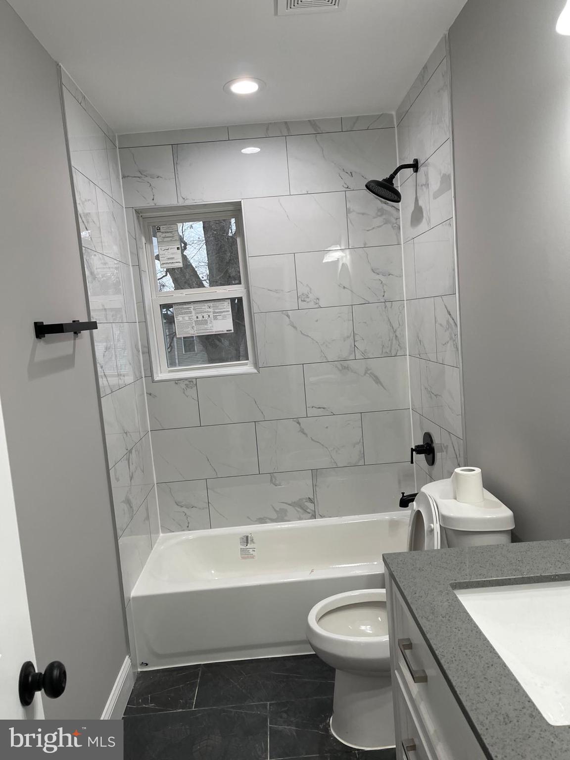 273 56th Place Northeast Washington, DC 20019 - Photo 24 of 25 a bathroom with a sink a toilet and shower