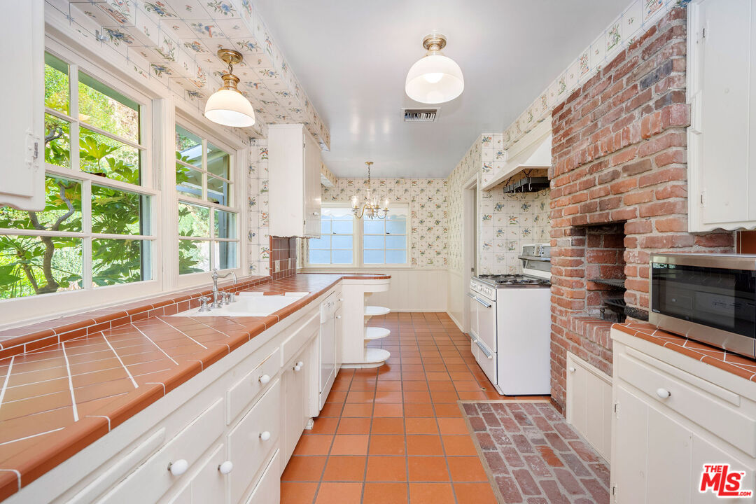 3520 Longridge Avenue Sherman Oaks, CA 91423 - Photo 13 of 37 a large kitchen with a large window
