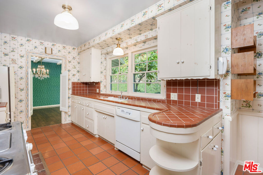 3520 Longridge Avenue Sherman Oaks, CA 91423 - Photo 15 of 37 a kitchen with a sink cabinets and window