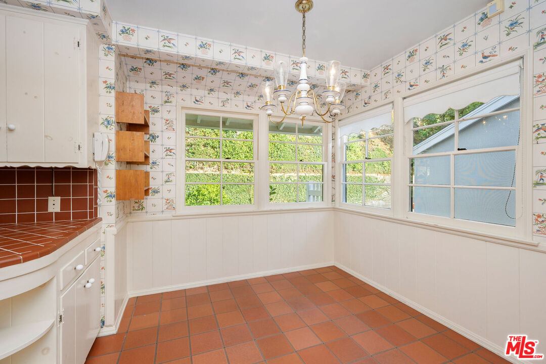 3520 Longridge Avenue Sherman Oaks, CA 91423 - Photo 17 of 37 a view of a big room with windows and chandelier