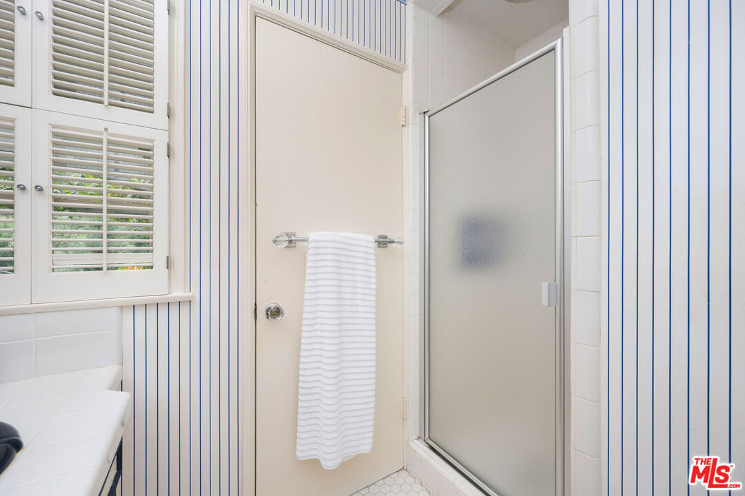 3520 Longridge Avenue Sherman Oaks, CA 91423 - Photo 21 of 37 a bathroom with a bathtub and a shower
