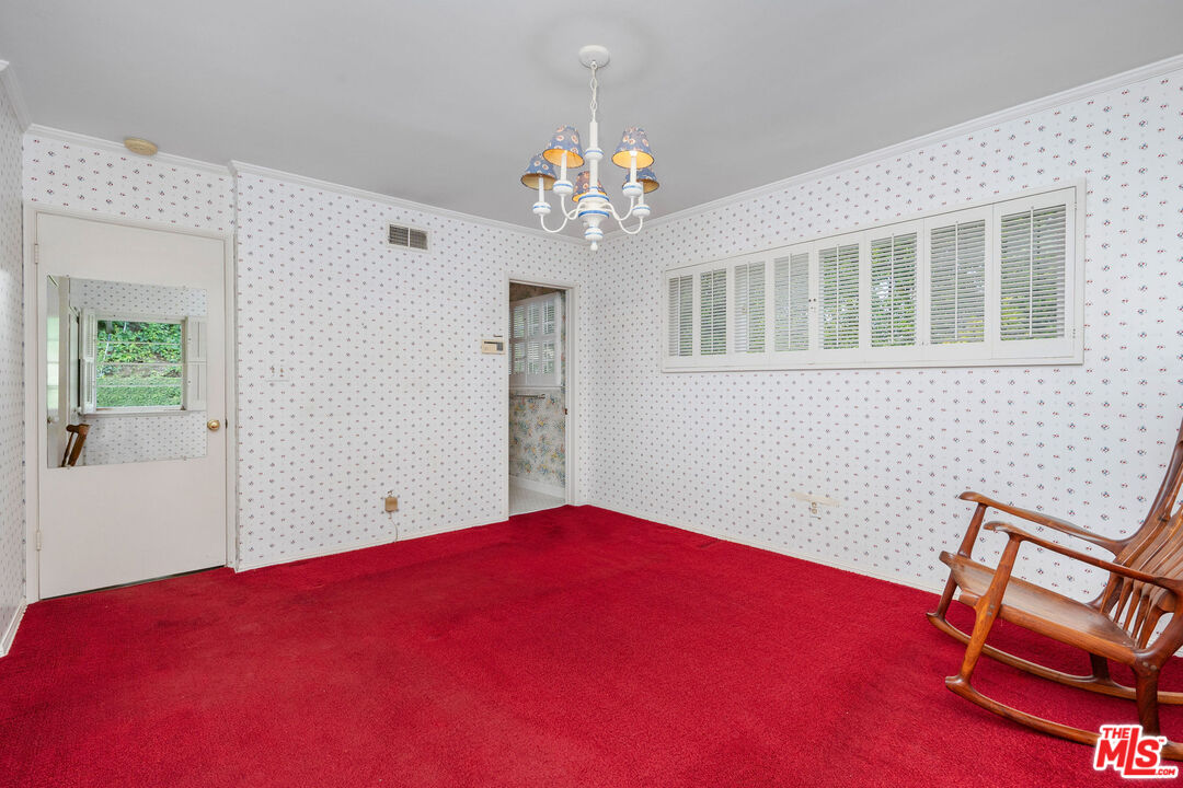 3520 Longridge Avenue Sherman Oaks, CA 91423 - Photo 23 of 37 a bedroom with a bed and a chandelier