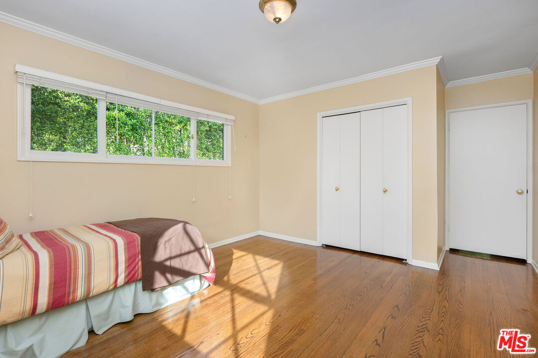 3520 Longridge Avenue Sherman Oaks, CA 91423 - Photo 26 of 37 a bedroom with a bed and a window