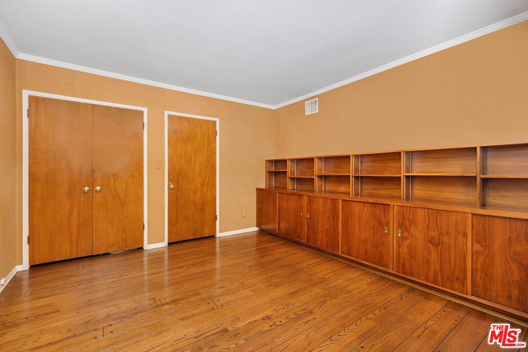 3520 Longridge Avenue Sherman Oaks, CA 91423 - Photo 28 of 37 a view of an empty room with wooden floor and a window
