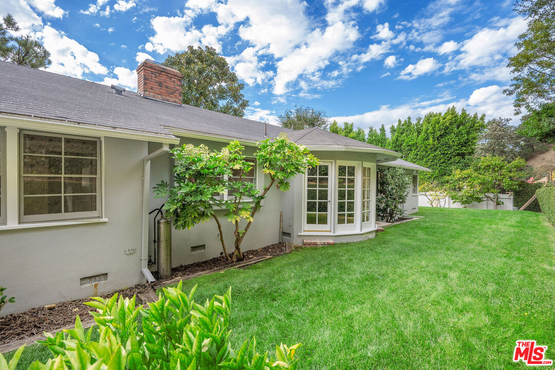 3520 Longridge Avenue Sherman Oaks, CA 91423 - Photo 31 of 37 a view of a house with backyard and garden