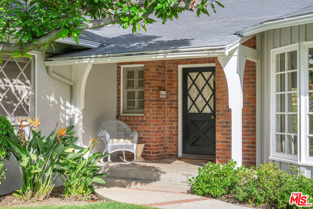 3520 Longridge Avenue Sherman Oaks, CA 91423 - Photo 4 of 37 a front view of a house with garden
