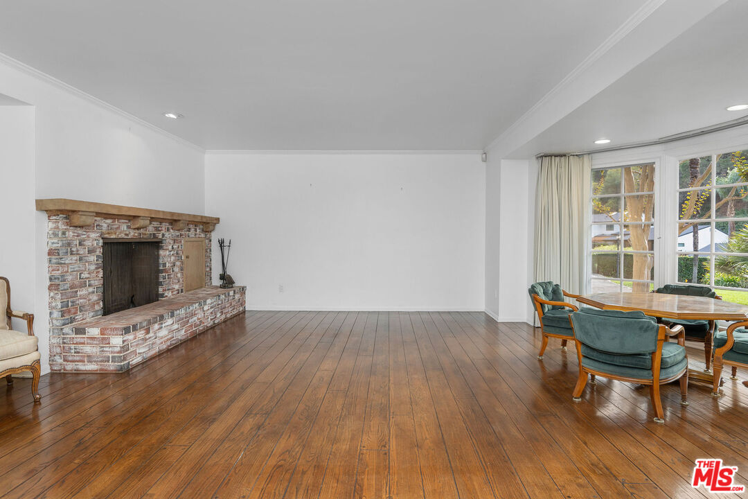 3520 Longridge Avenue Sherman Oaks, CA 91423 - Photo 6 of 37 a living room with furniture and a fireplace