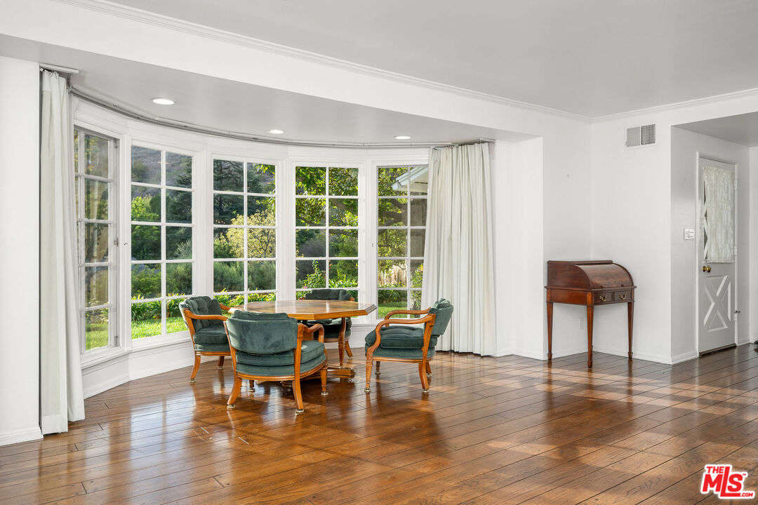 3520 Longridge Avenue Sherman Oaks, CA 91423 - Photo 8 of 37 a dining room with furniture and wooden floor