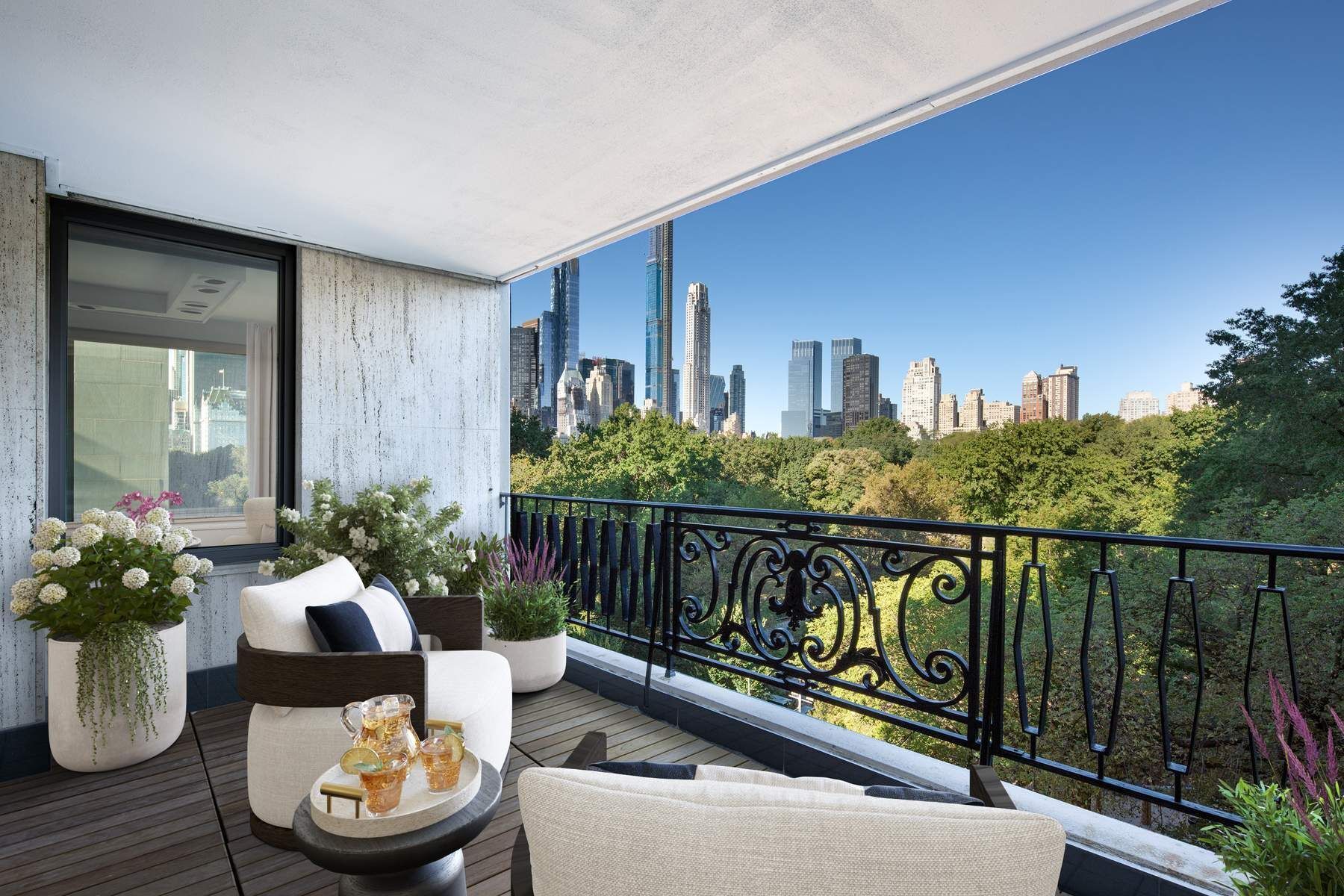 857 5th Avenue, Unit 7 Manhattan, NY 10065 - Photo 1 of 22 a balcony with couple of flower plants and wooden fence