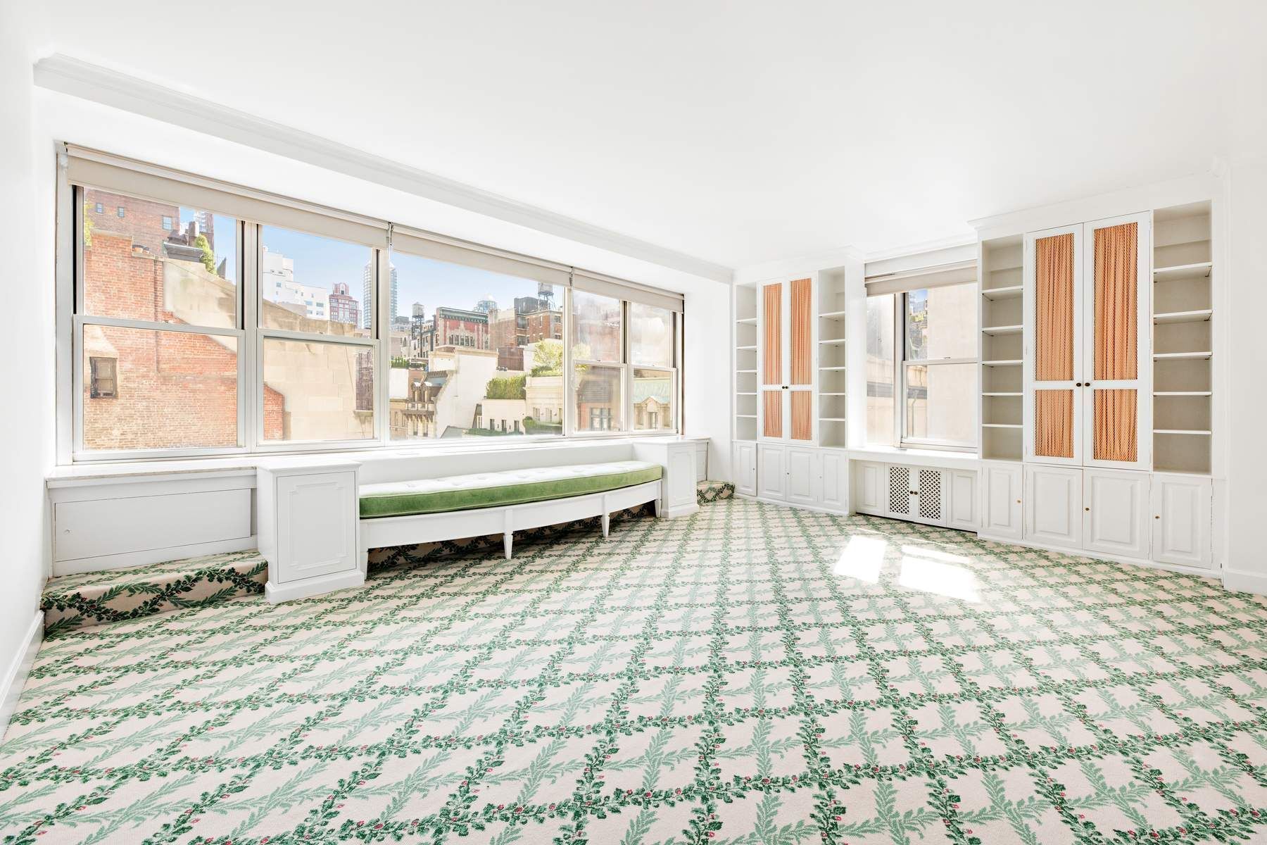 857 5th Avenue, Unit 7 Manhattan, NY 10065 - Photo 13 of 22 a living room with a large window