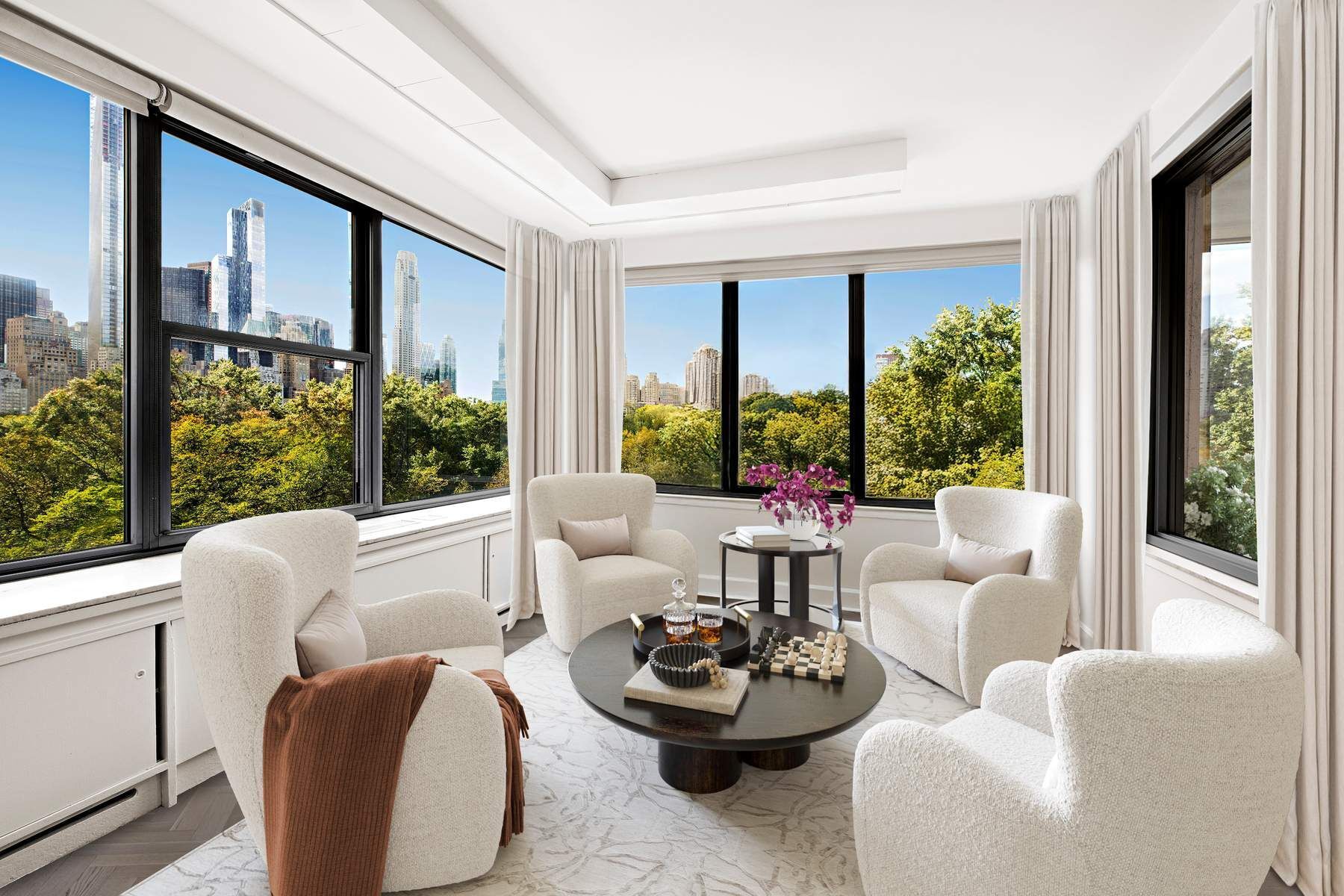 857 5th Avenue, Unit 7 Manhattan, NY 10065 - Photo 6 of 22 a living room with furniture and a large window