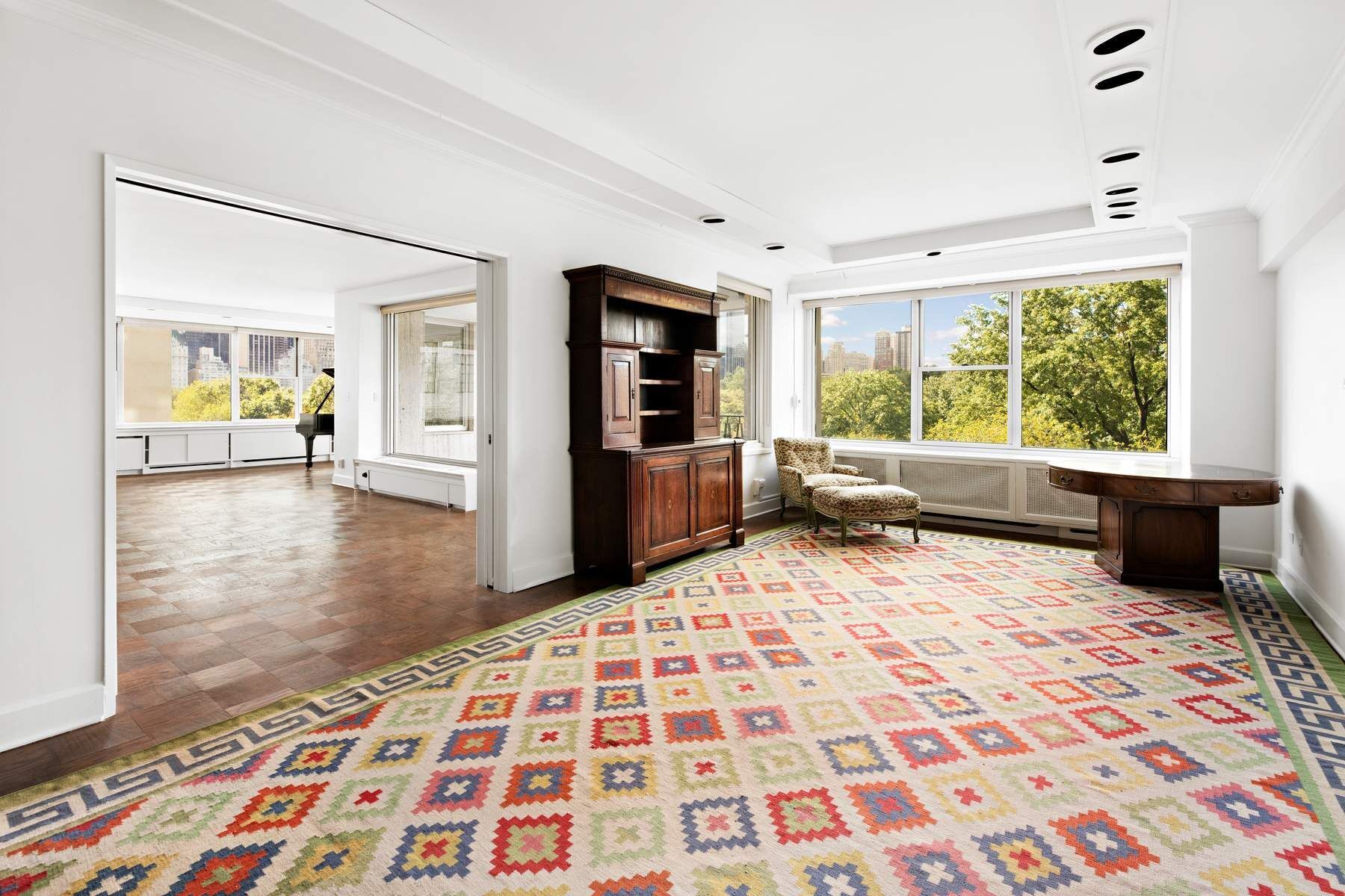 857 5th Avenue, Unit 7 Manhattan, NY 10065 - Photo 9 of 22 a large bedroom with a bed and a window