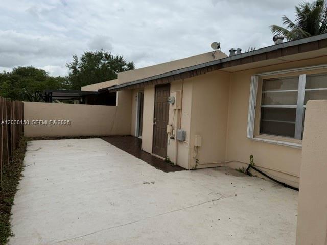 11206 Southwest 125th Place, Unit 11206 Miami, FL 33186 - Photo 13 of 15 a view of a house with a garage