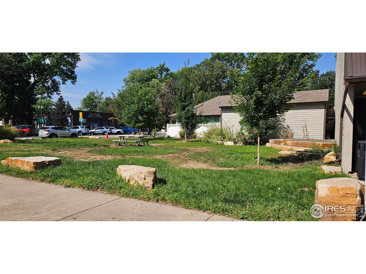 615 4th Street Berthoud, CO 80513 - Photo 3 of 4 a front view of a house with a yard