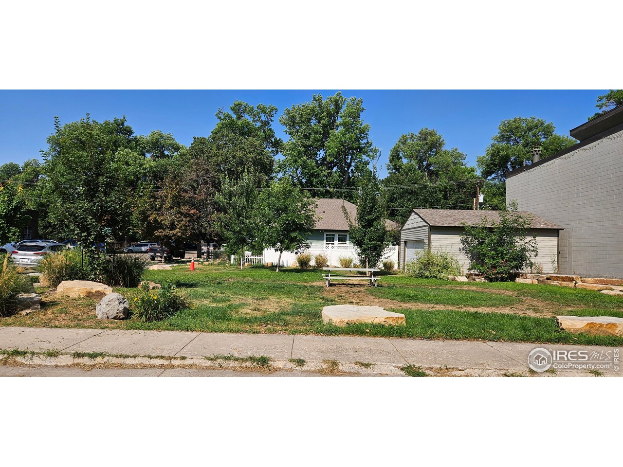 615 4th Street Berthoud, CO 80513 - Photo 4 of 4 a view of a house with a yard and a garden