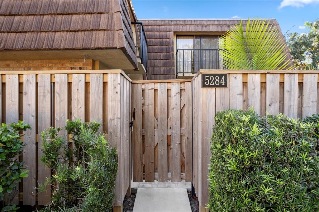 a view of a wooden door with a house