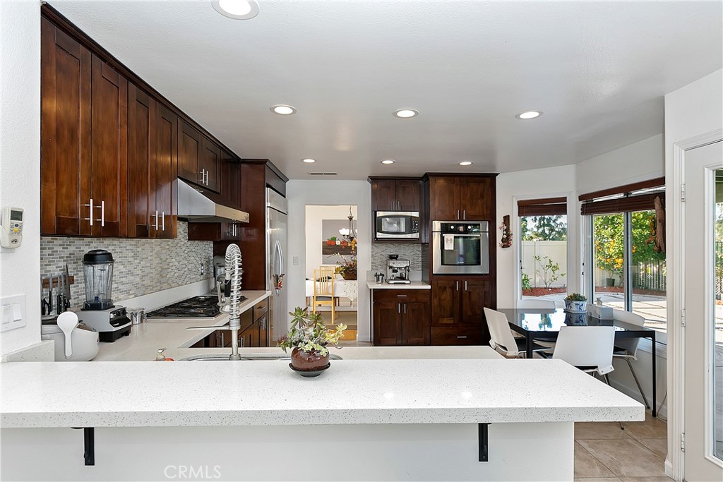 747 Donatello Drive Corona, CA 92882 - Photo 14 of 56 a view of a living room and kitchen