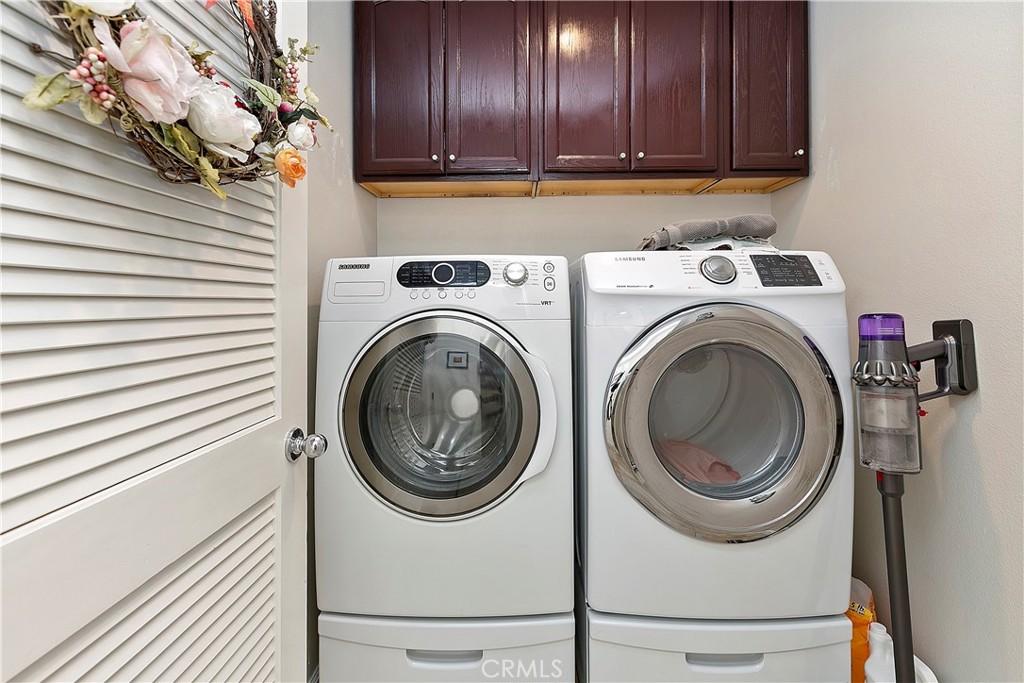 747 Donatello Drive Corona, CA 92882 - Photo 23 of 56 a view of a storage and utility room with washer and dryer