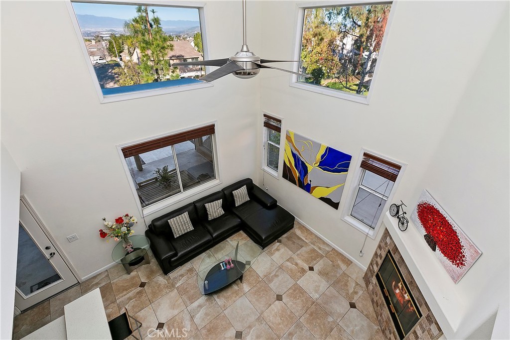 747 Donatello Drive Corona, CA 92882 - Photo 26 of 56 a living room with furniture and a flat screen tv
