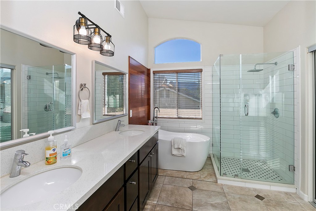 747 Donatello Drive Corona, CA 92882 - Photo 31 of 56 a bathroom with a granite countertop sink a toilet and shower