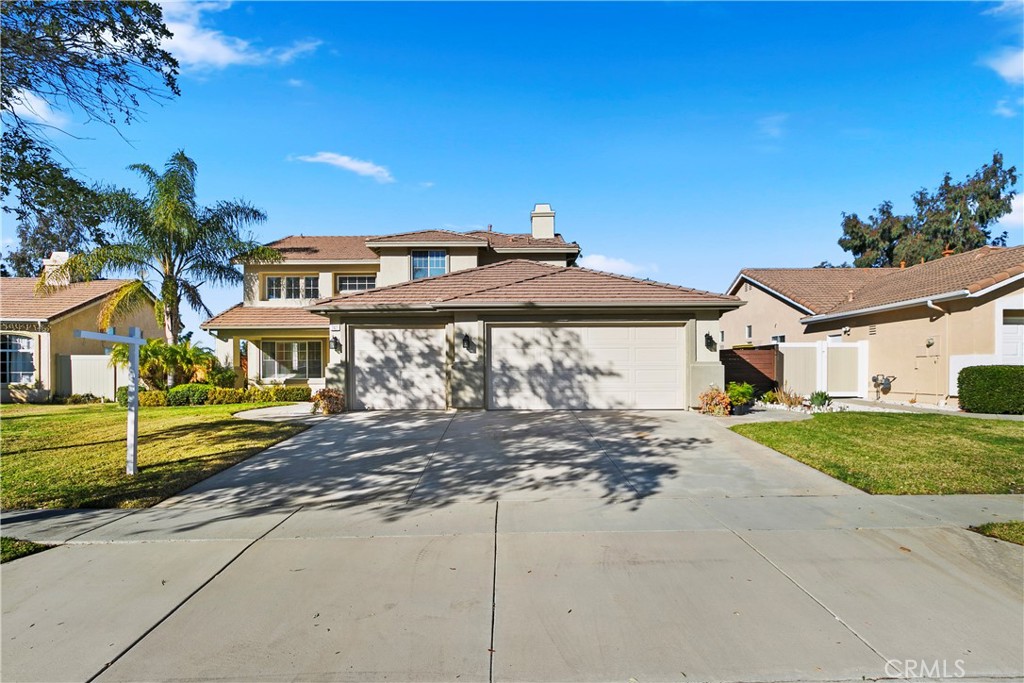 747 Donatello Drive Corona, CA 92882 - Photo 4 of 56 a front view of a house with a yard