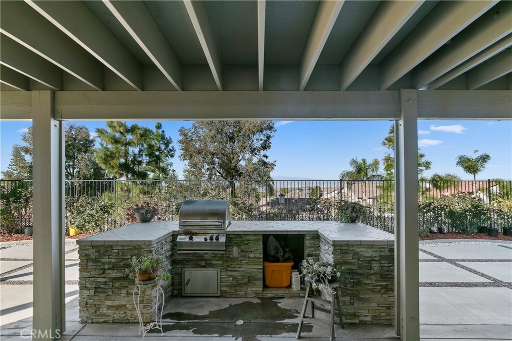 747 Donatello Drive Corona, CA 92882 - Photo 49 of 56 a view of a porch with furniture and a yard