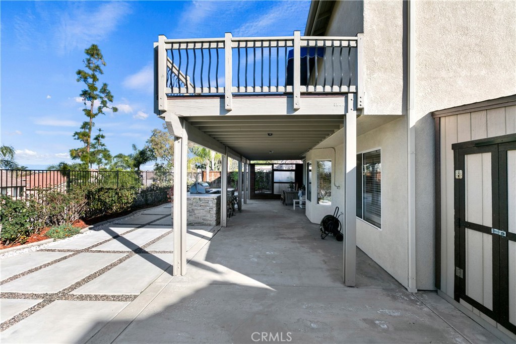 747 Donatello Drive Corona, CA 92882 - Photo 50 of 56 a view of a chairs and tables in the back yard of the house