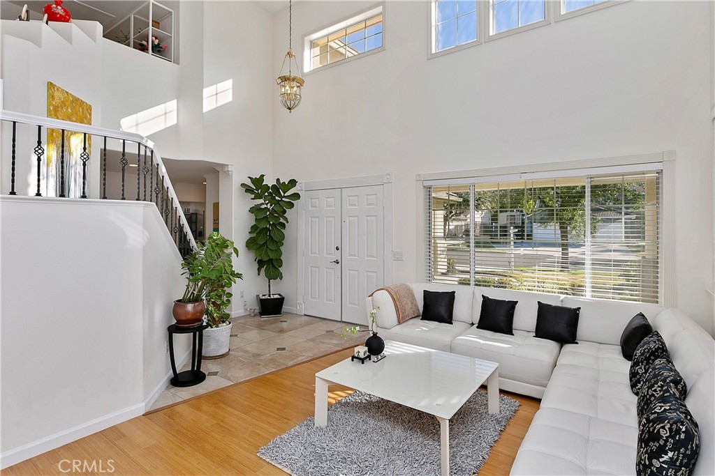 747 Donatello Drive Corona, CA 92882 - Photo 9 of 56 a living room with furniture and a potted plant