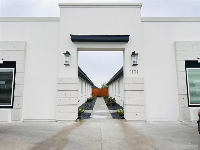 a front view of a house with garage