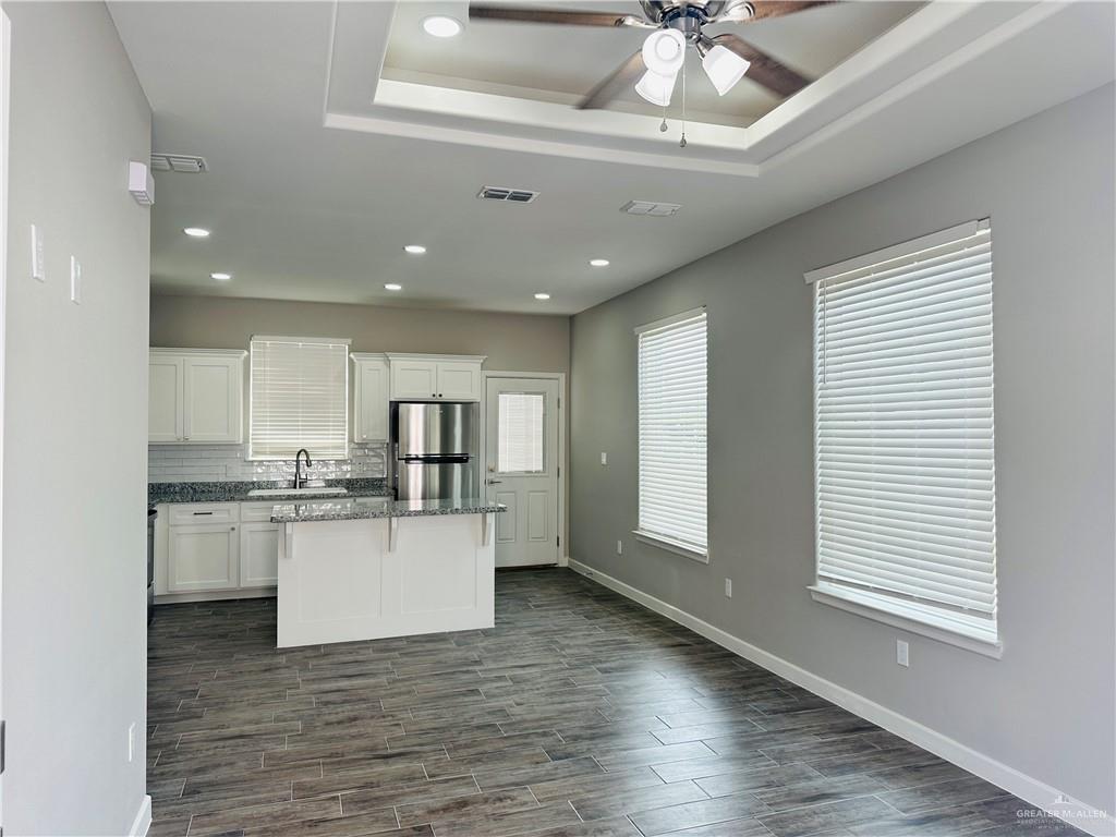 1101 Sugar Gdn Drive, Unit 1 Pharr, TX 78577 - Photo 2 of 10 a kitchen with stainless steel appliances granite countertop a stove and cabinets