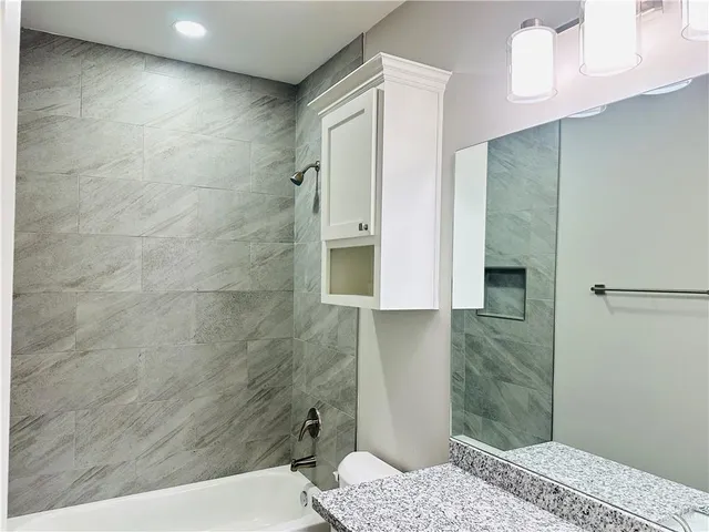 a bathroom with a sink and a shower