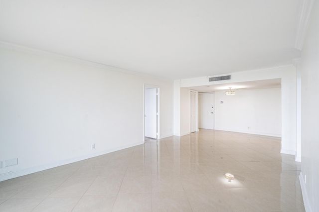 a room with pool tables and wooden floor