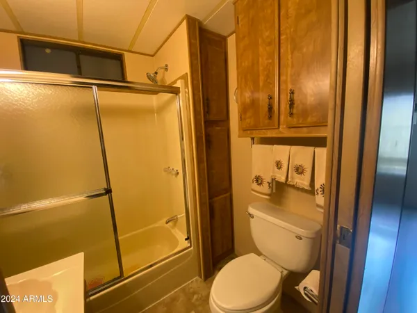a bathroom with a toilet and shower