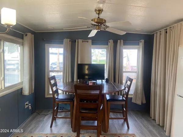 a dining room with furniture and window
