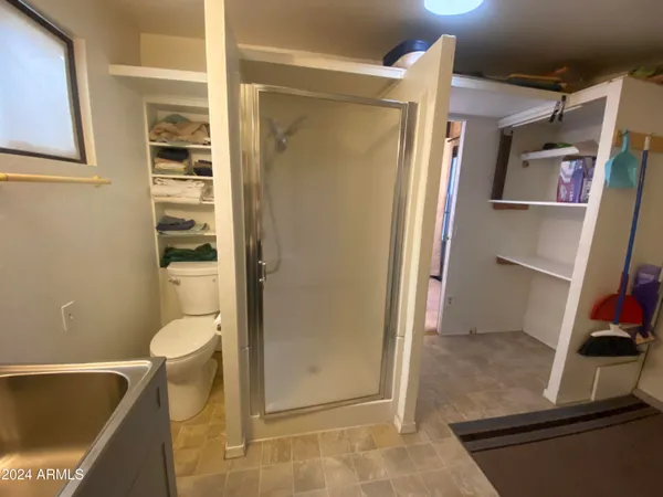 a bathroom with a tub and shower