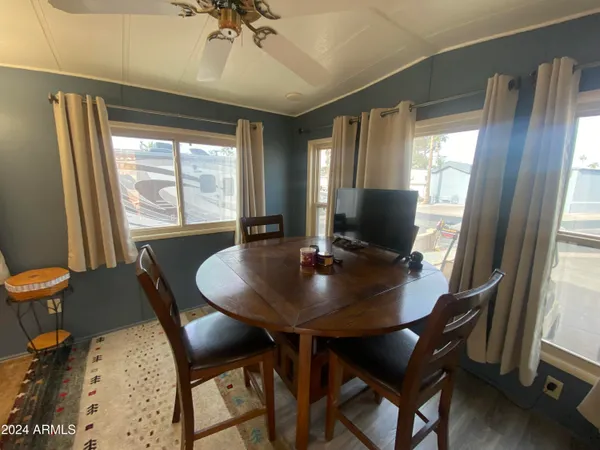 a view of a dining room with furniture and wooden floor
