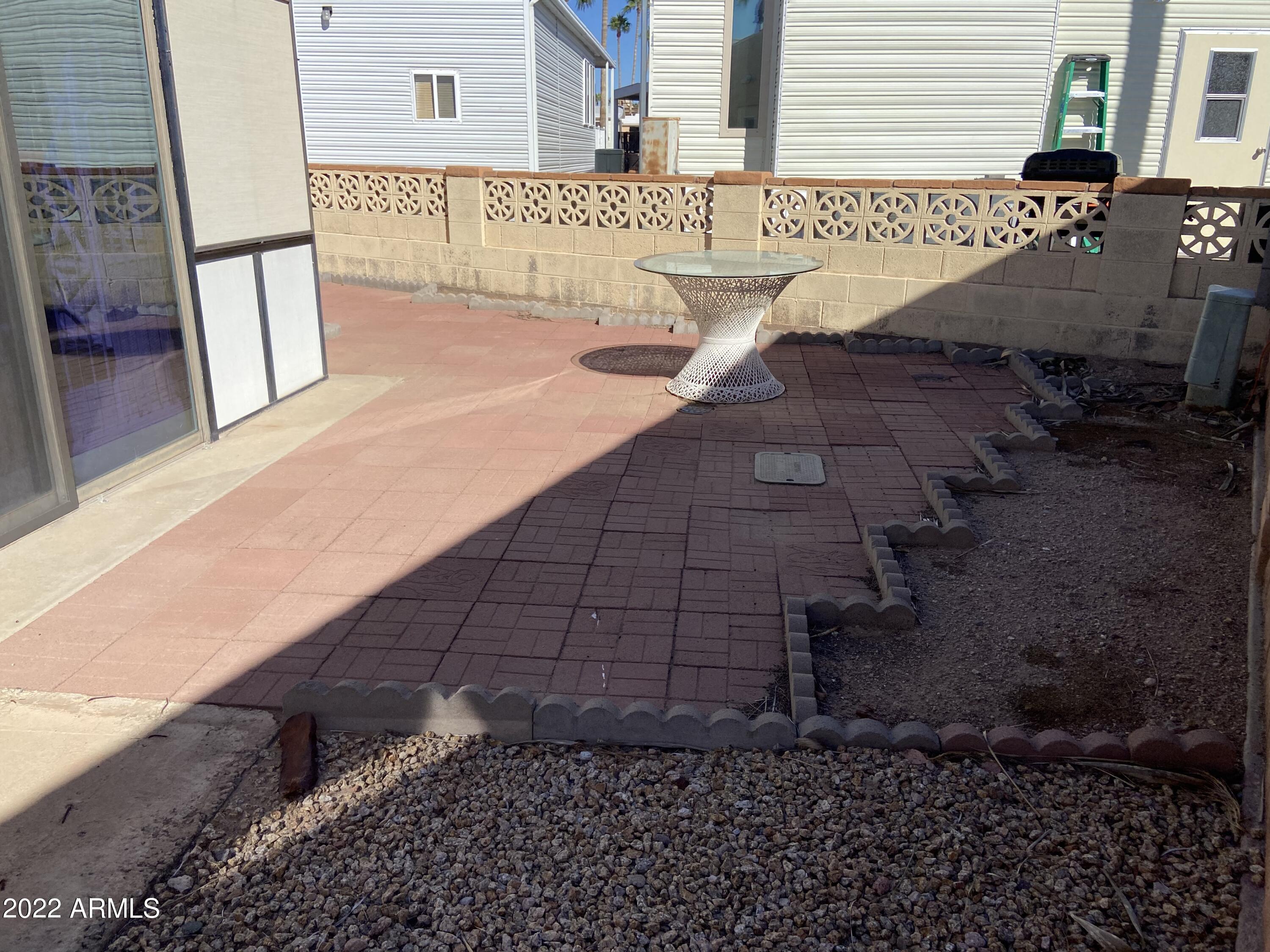 2323 South Pomo Avenue Apache Junction, AZ 85119 - Photo 31 of 42 a view of a patio with wooden floor