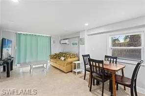 a view of a balcony with chairs and a potted plant