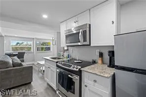 a living room with furniture and window