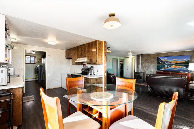 a dining room with furniture and window
