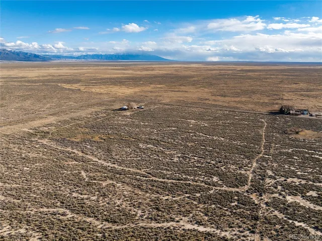 a view of a car park in front of house