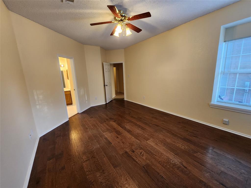 2413 Timber Ridge Lane Flower Mound, TX 75028 - Photo 17 of 32 Wood-finish flooring extending throughout the room