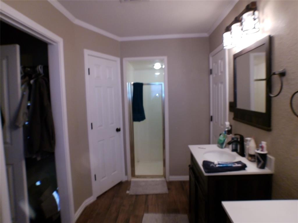 200 County Road 3170 Decatur, TX 76234 - Photo 11 of 31 a bathroom with a sink and a mirror