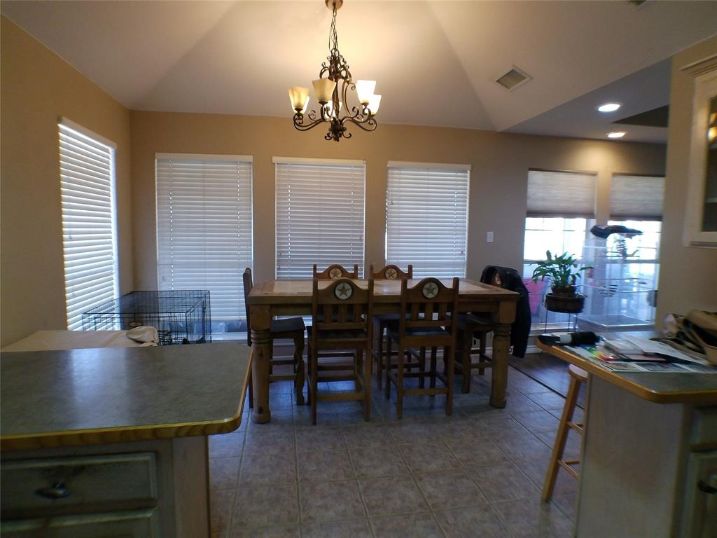 200 County Road 3170 Decatur, TX 76234 - Photo 21 of 31 a view of a dining room with furniture and chandelier