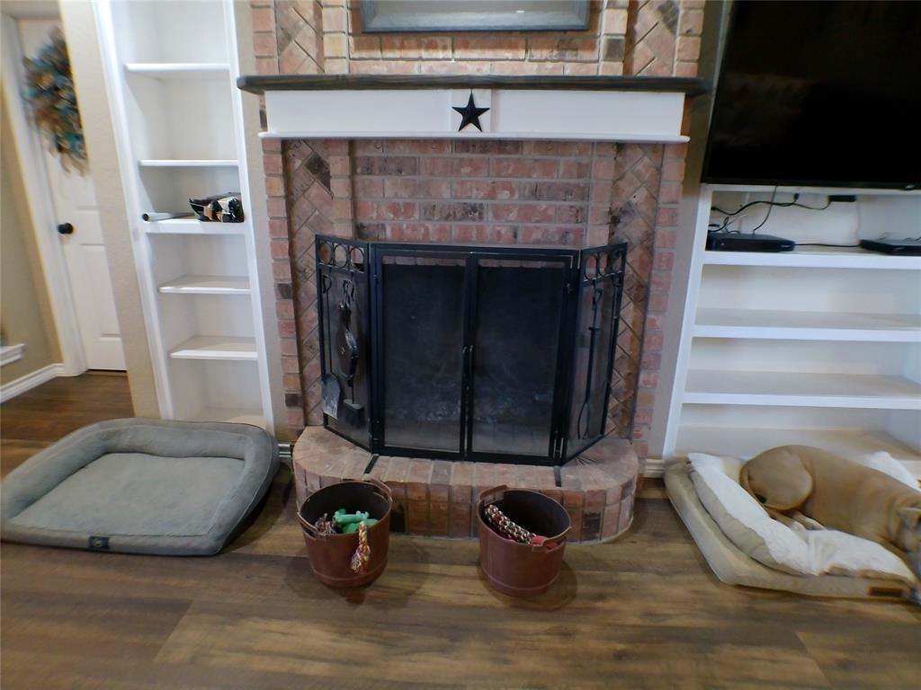 200 County Road 3170 Decatur, TX 76234 - Photo 23 of 31 a living room with furniture and a fireplace